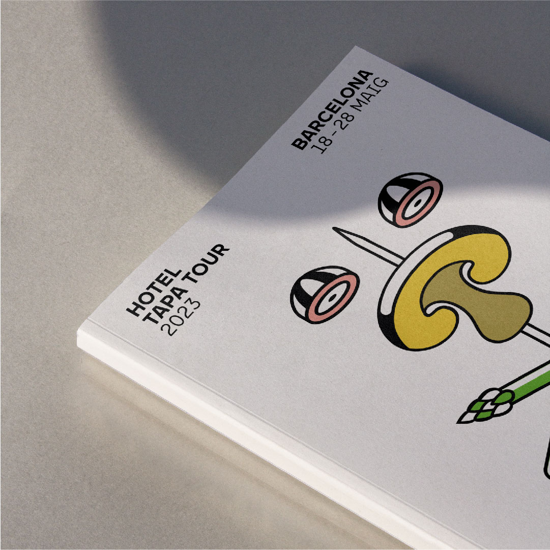 <span><span>Photograph of a book with an element of the graphic of the HOTEL TAPA TOUR 2023. Designed by the branding and communication studio/agency Esiete (Barcelona Spain)</span></span>